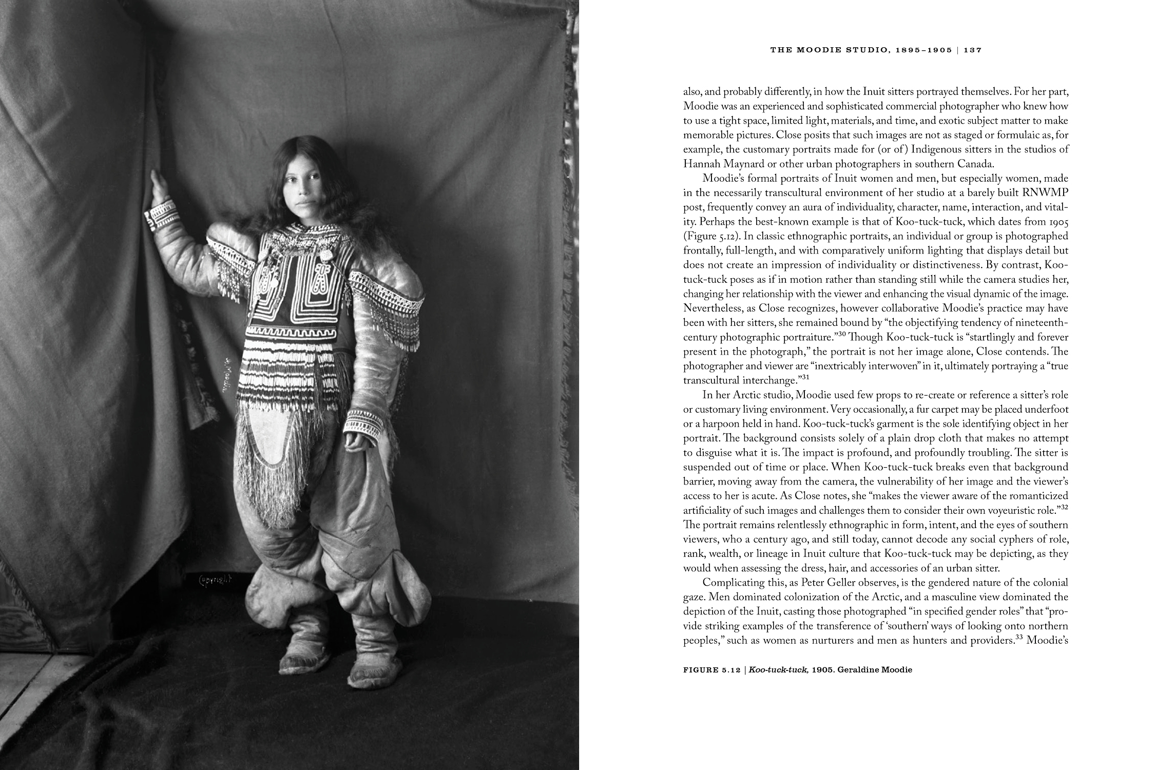 Interior spread from ‘Rare Merit’ shows a black and white photograph of Koo-tuck-tuck, an Inuit woman, standing in a studio against a cloth backdrop. The photo was taken in 1905 by Geraldine Moodie.